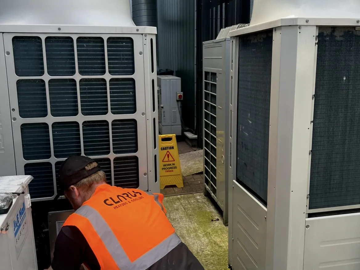 A Clarus engineer servicing external commercial air-conditioning plant