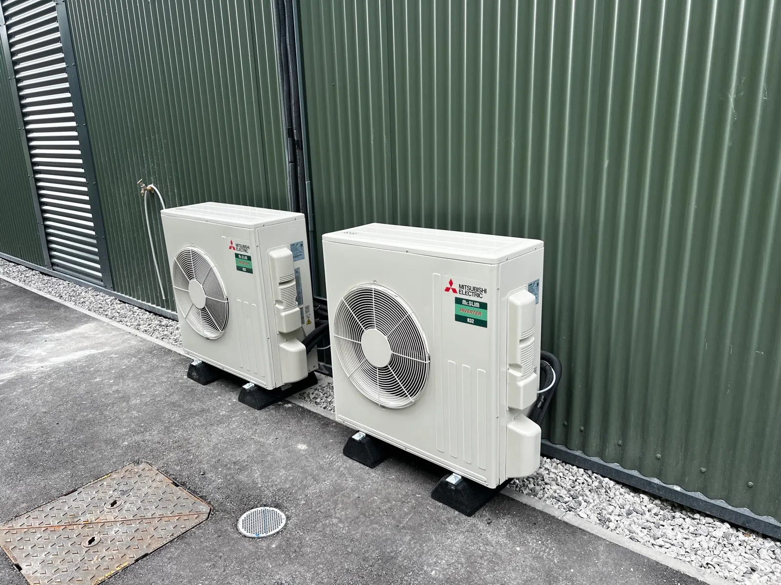 Two Mitsubishi Electric condensers wall-mounted externally by Clarus