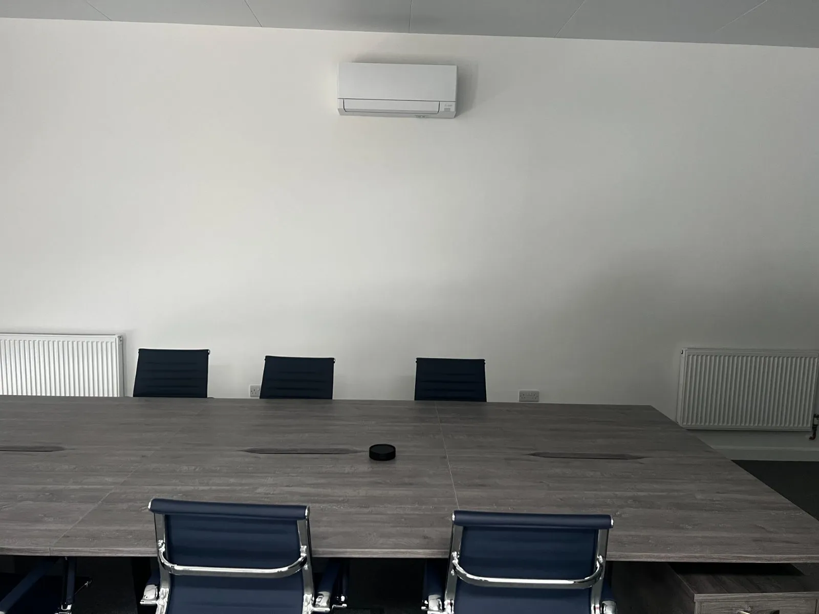 Mitsubishi wall cassette mounted in a commercial meeting room